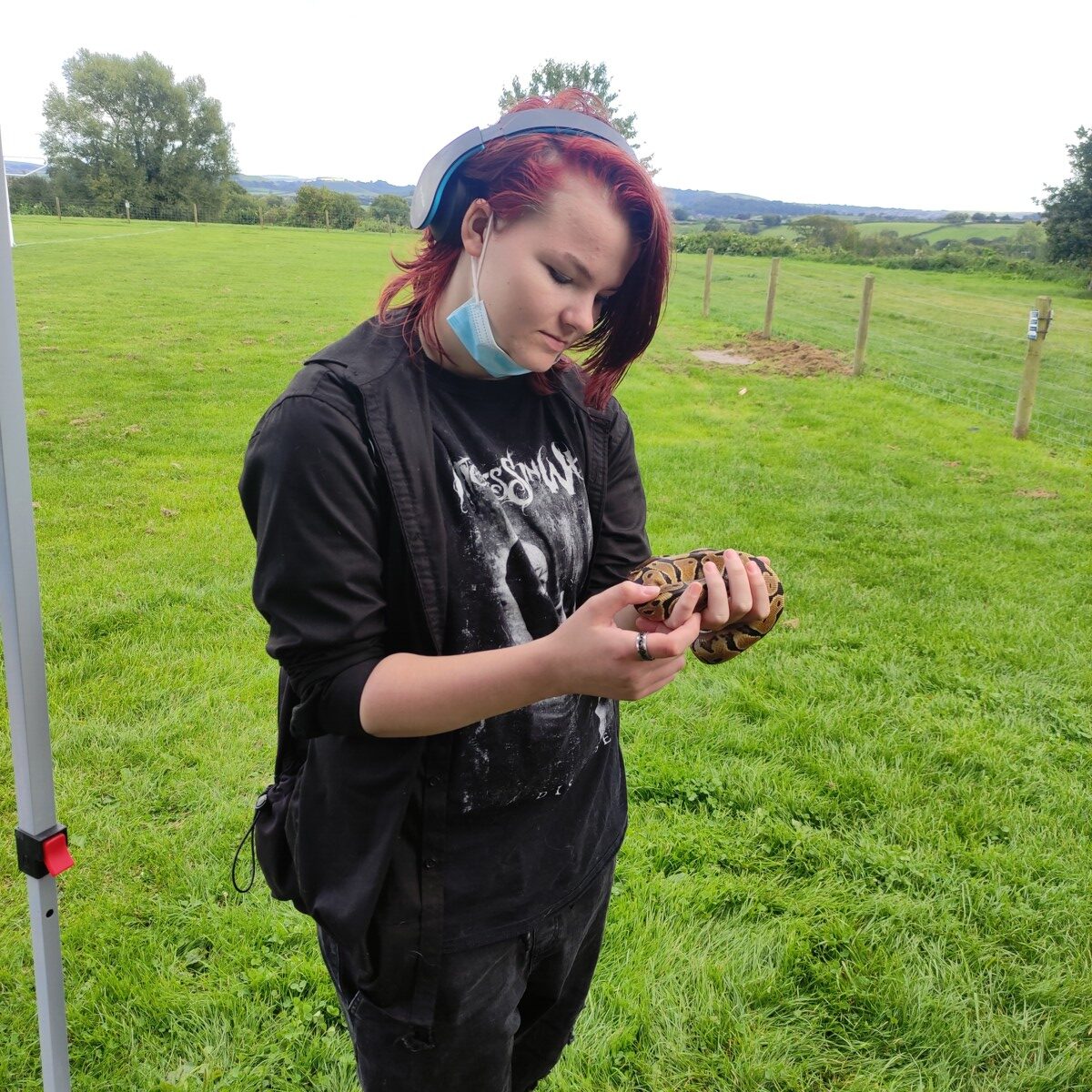 Young person holding a snake